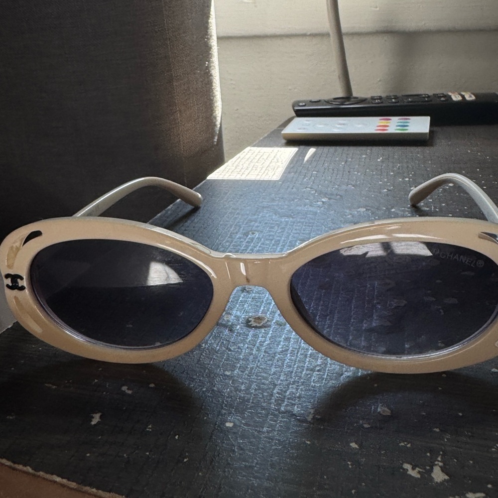 beige oval sunglasses